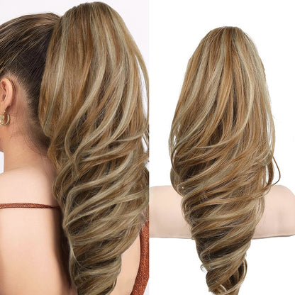 Grab the ponytail and twist the hair into a long, curly, wavy ponytail.